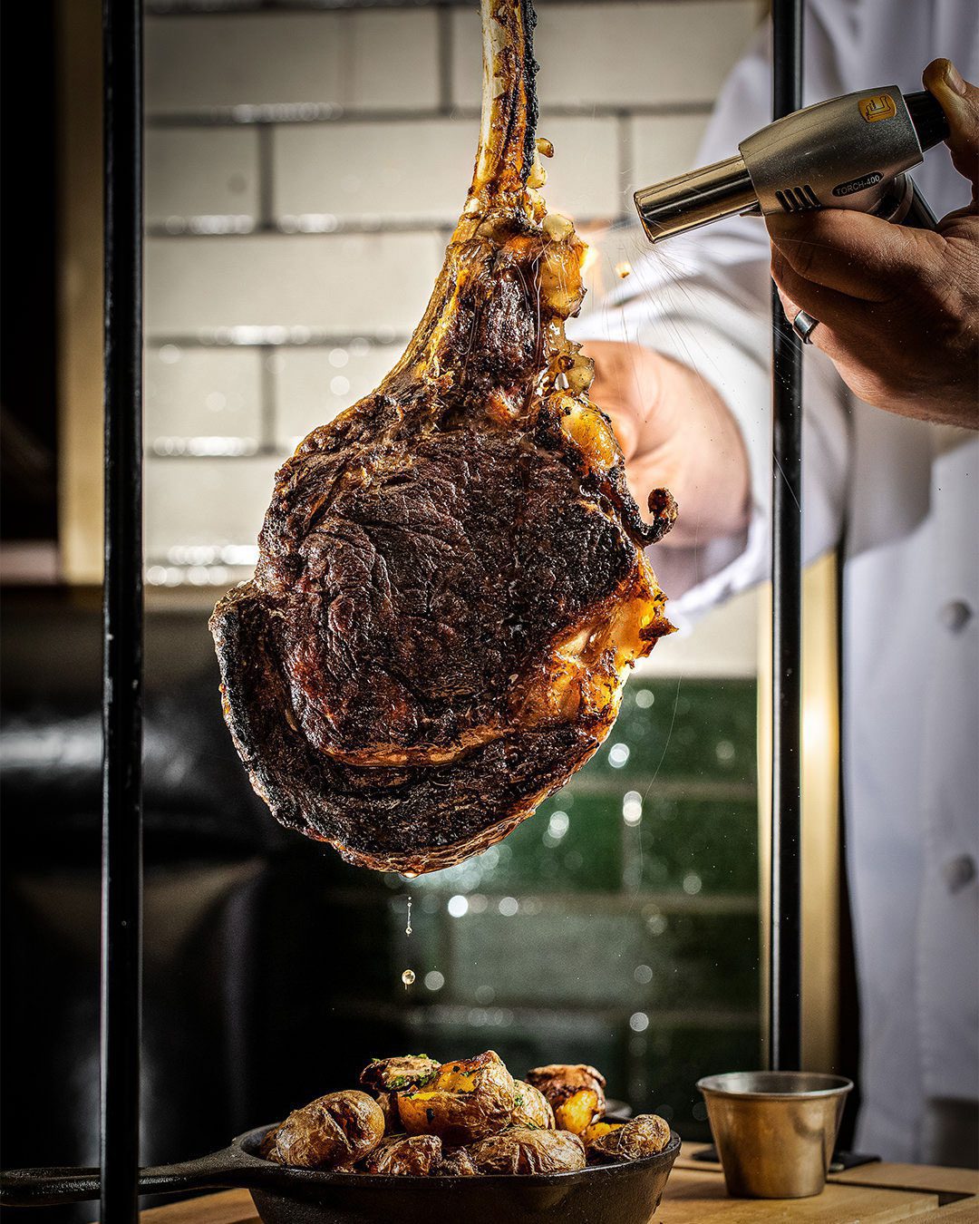 Swinging Tomahawk steak at Smith & Wollensky steakhouse