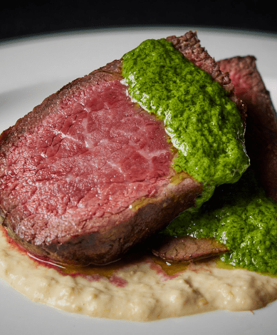 Steak with green dressing