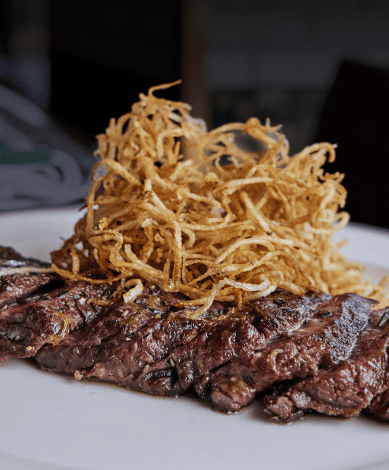 Steak with crispy potatoes on top