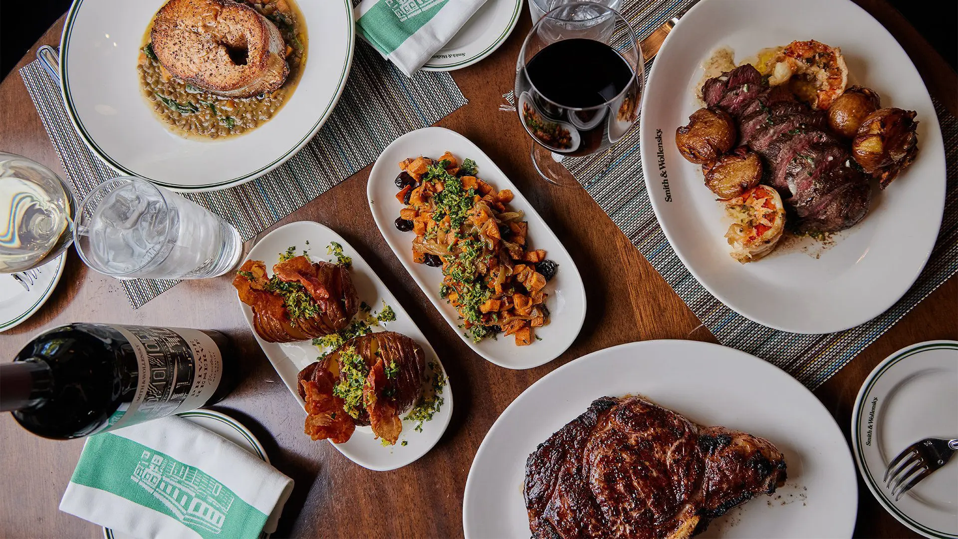 Table shot from above with food and wine