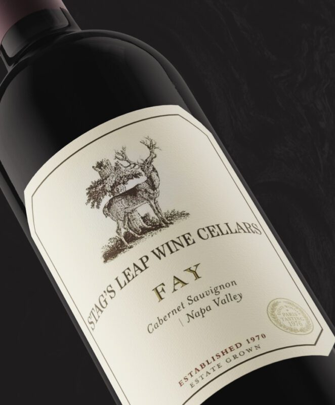 A bottle of Stag’s Leap Wine Cellars FAY Cabernet Sauvignon from Napa Valley, featuring a cream label with an illustration of a stag and trees, and gold embossed details.