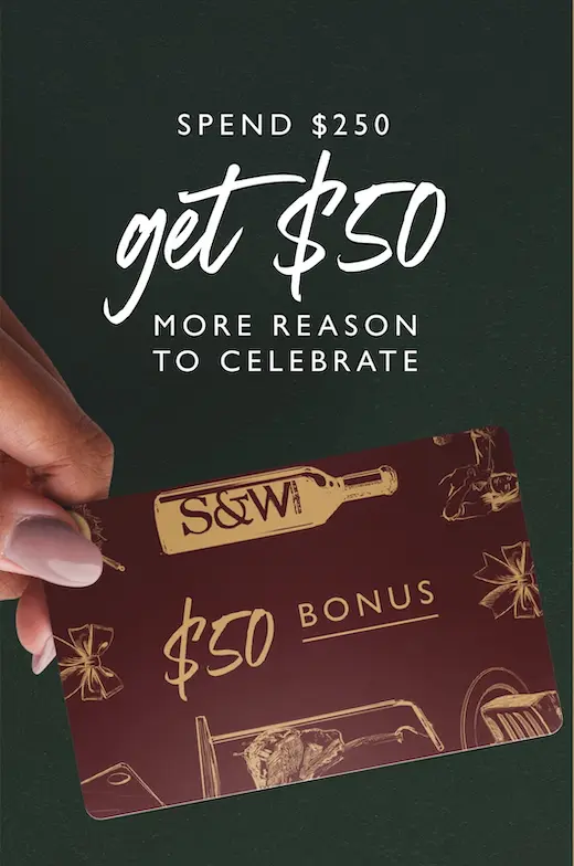 A hand holds a $50 bonus card with wine bottle and gift illustrations. Text above reads, “Spend $250, get $50. More reason to celebrate.” The background is dark green.